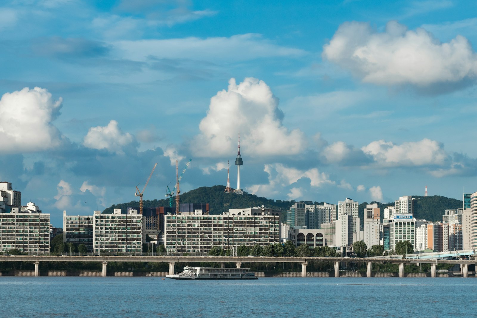 Cityscape with namsan tower under cloudy sky